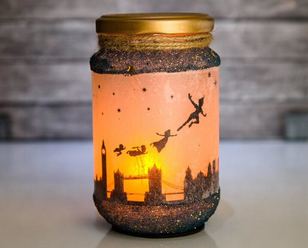 Candle jar decorated with London skyline and Peter Pan, Wendy, John, and Michael flying through the sky