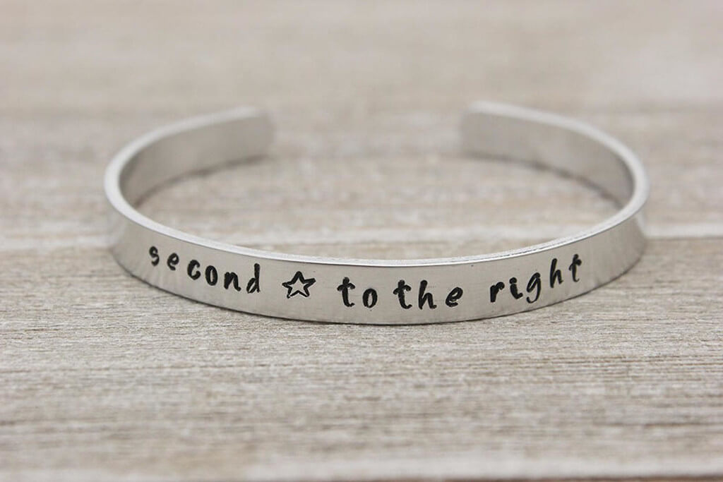 Silver bracelet with the quote "Second star to the right"