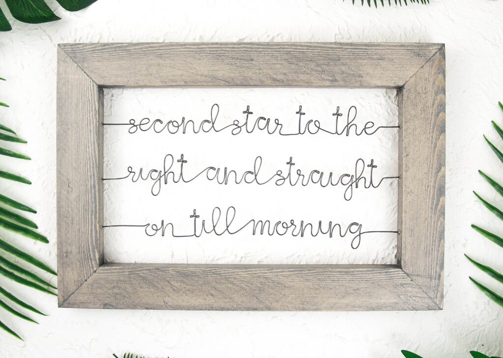 Wooden frame and wire art that reads: "Second star to the right and straight on till morning"