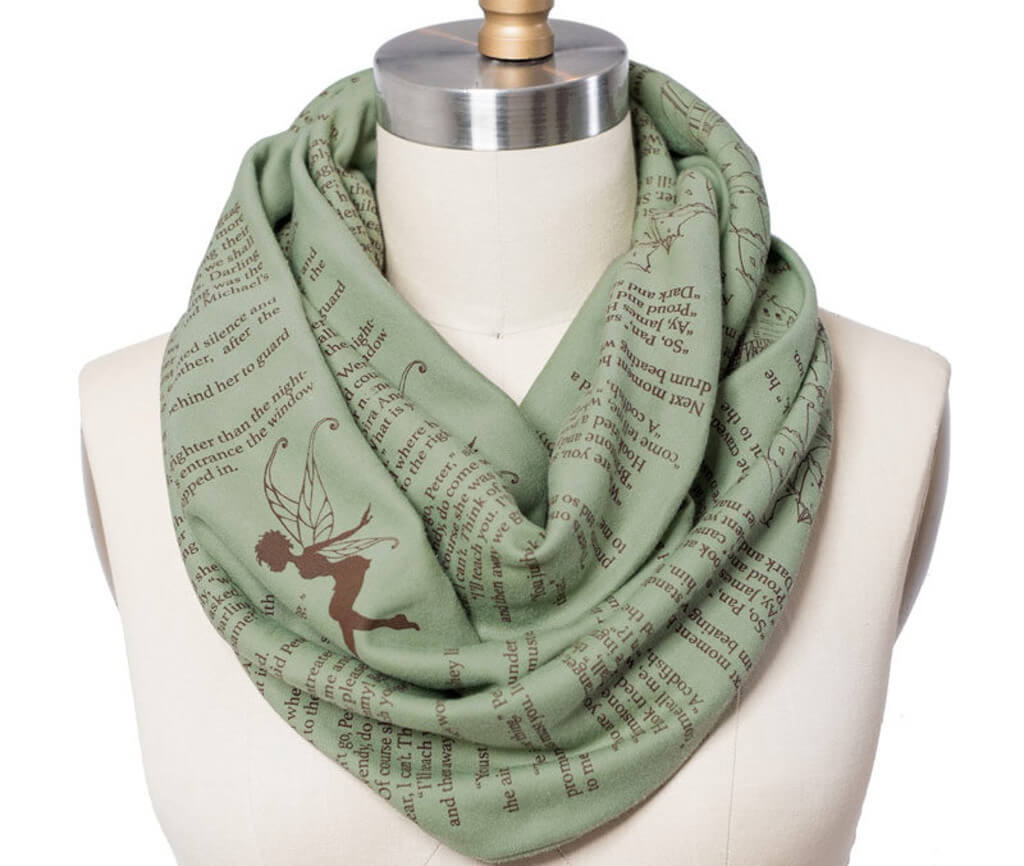 Green scarf with text from Peter Pan printed on it in brown ink