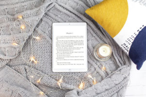 Tablet e-reader with string lights surrounding it