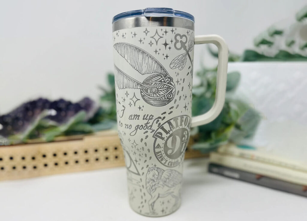 Laser engraved tumbler with Harry Potter themes, like the Golden Snitch, Platform 9 3/4, and more by FastPaceLaser