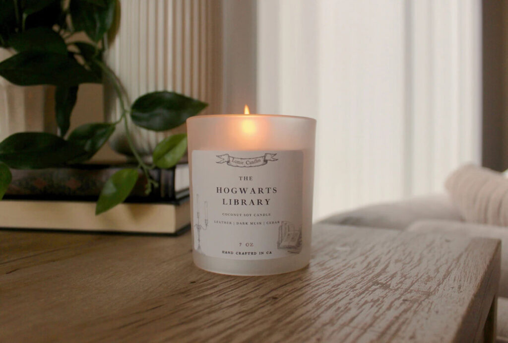 A burning candle that says "The Hogwarts Library" by LumieCandle