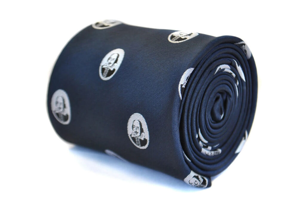 Navy tie with Shakespeare face pattern by Fredrick Thomas