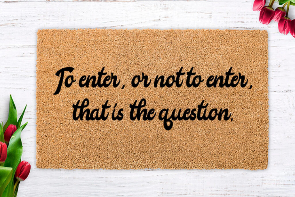 Doormat that says "to enter, or not to enter, that is the question" by WOWmats