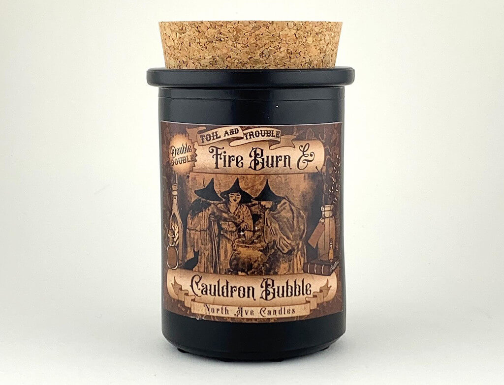 Witches Brew Candle in a black jar with a cork lid. By North Ave Candles.