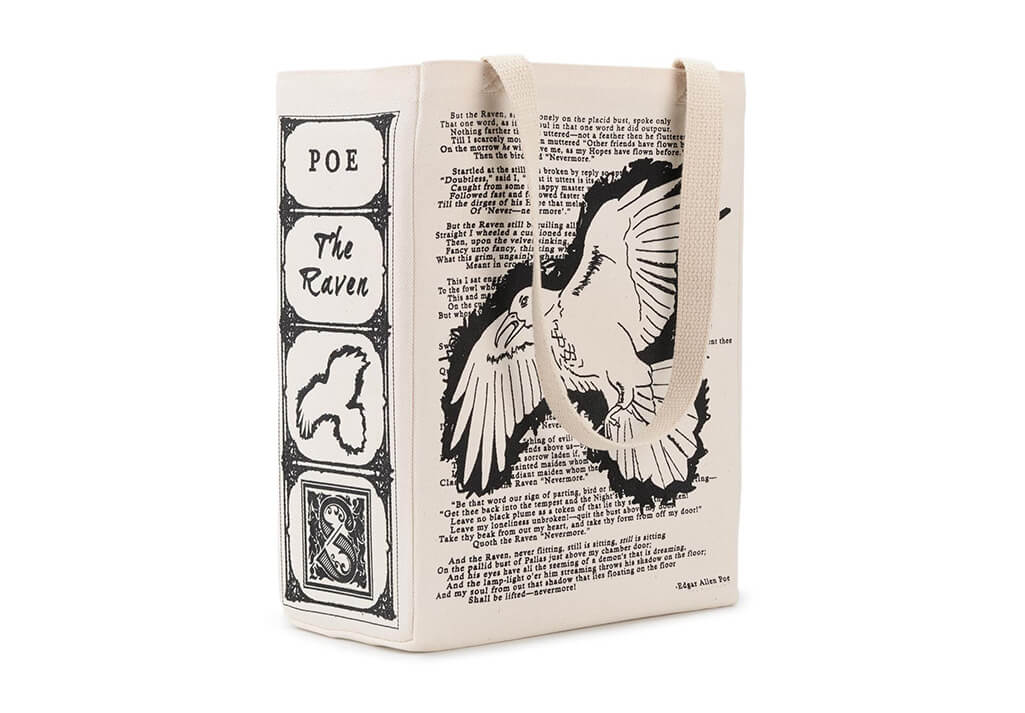 Cream tote with black writing and an image of a raven. By Storiarts