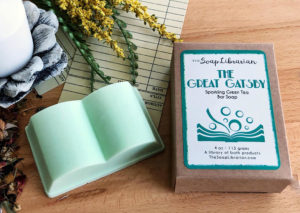 Mint green book-shaped soap on table. By The Soap Librarian