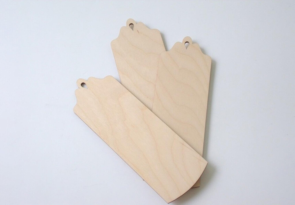 Three wooden bookmarks with laser cut tops by Senas Naujas Craft Fair