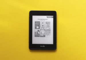 Kindle Paperwhite on a yellow background