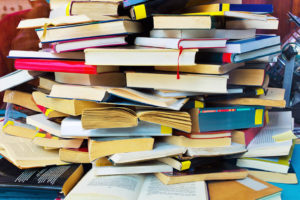 Messy stack of books piled on top of each other