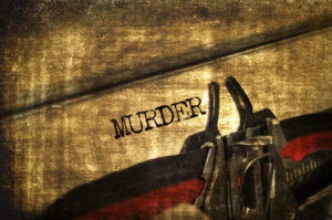 Typewriter with word "Murder" typed out