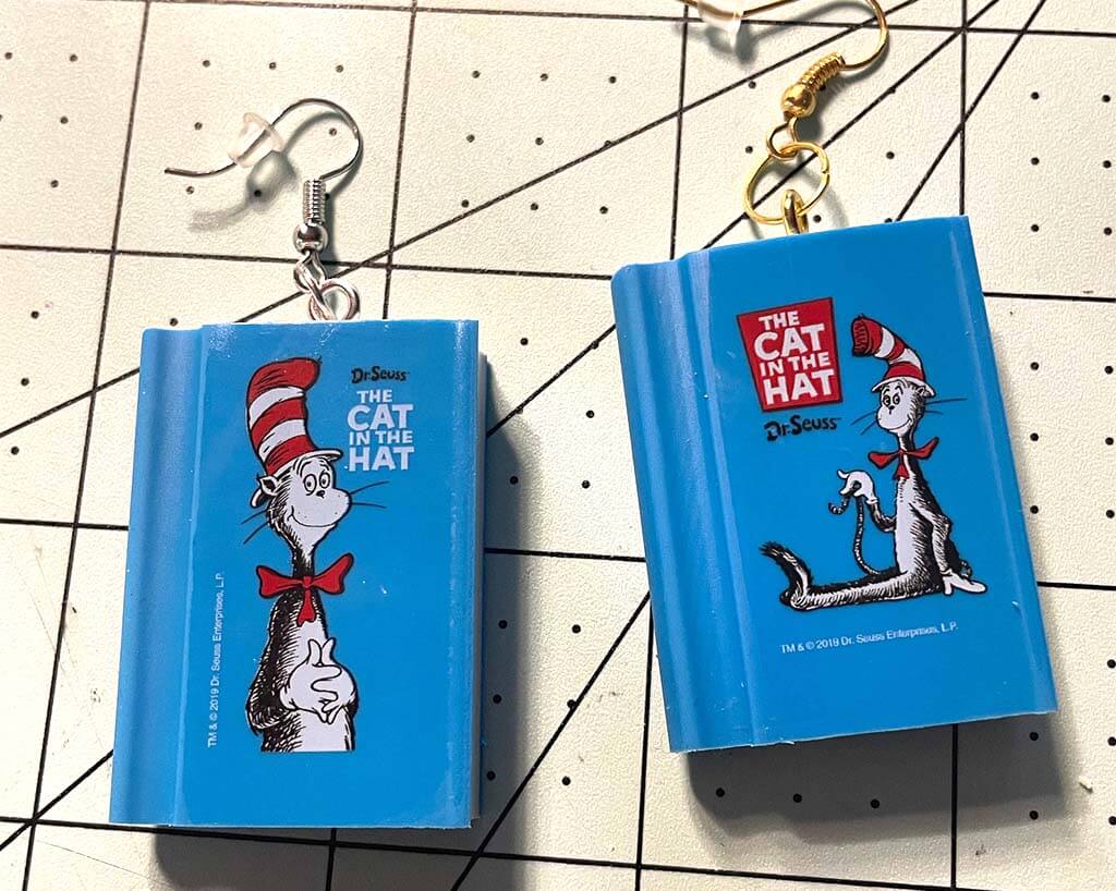Blue book-shaped drop earrings with image of the cat in the hat on the front by R59Creates