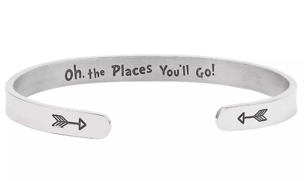 Silver cuff bracelet with the words "oh the places you'll go" hand stamped on it by RockInnovations