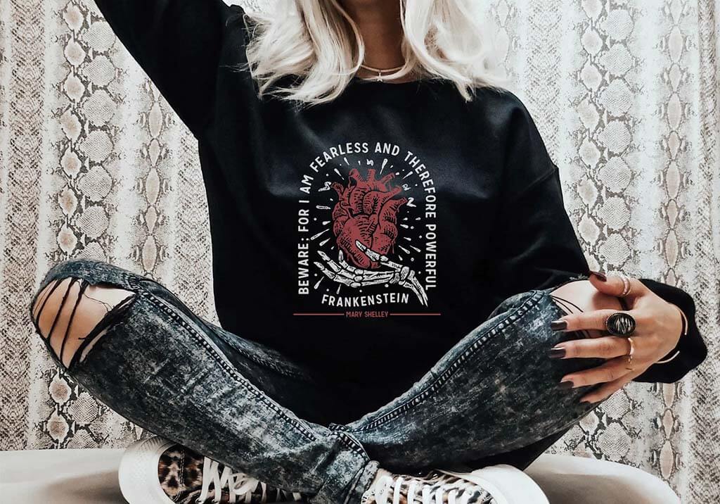Sweatshirt with an anatomical heart image and the quote "Beware for I am Fearless" by Cotton and Luxe