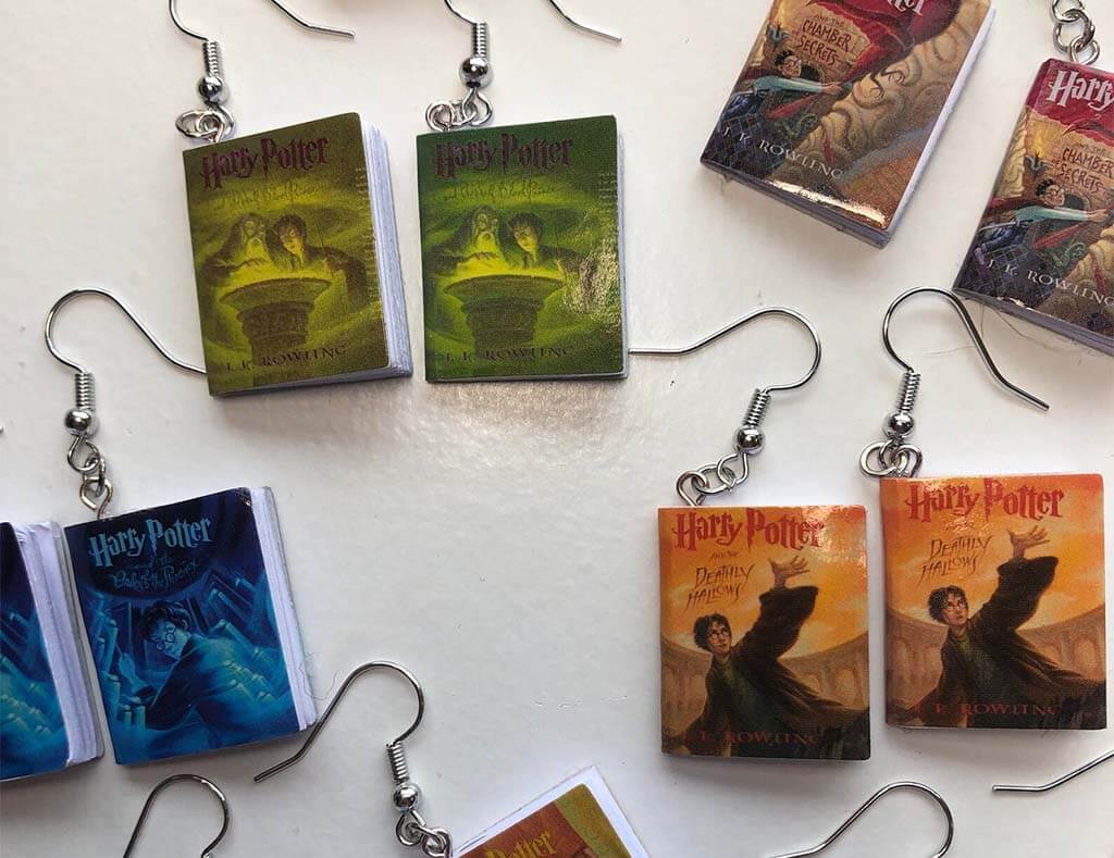 Book-shaped earrings with Harry Potter covers on them by WithLoveFromTtoYou