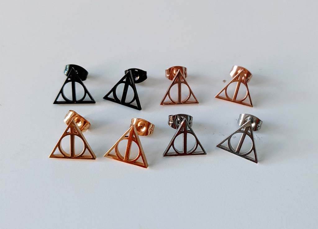 4 sets of stud earrings in black, gold, and silver with triangles, circle, and line Deathly Hallows symbol by Giftsofmv