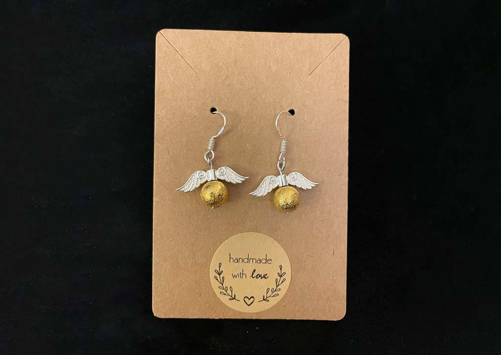 Earrings with golden pearl and wings to look like the Golden Snitch by DragonsMoonCrafts