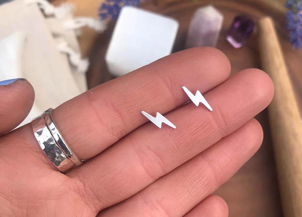 Silver lightning-shaped stud earrings by StopTheMoon