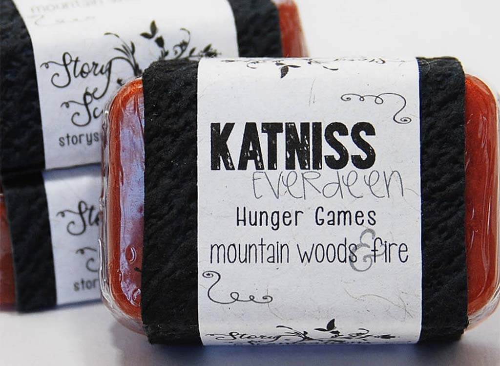 Red bar of soap with a label that reads "Katniss Everdeen" by StoryScentsations