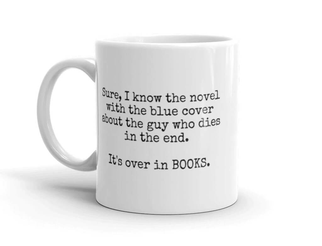 White mug with black text that says "Sure I know the novel with the blue cover and the guy who dies in the end. It's over in BOOKS" by InspireGiftsShop