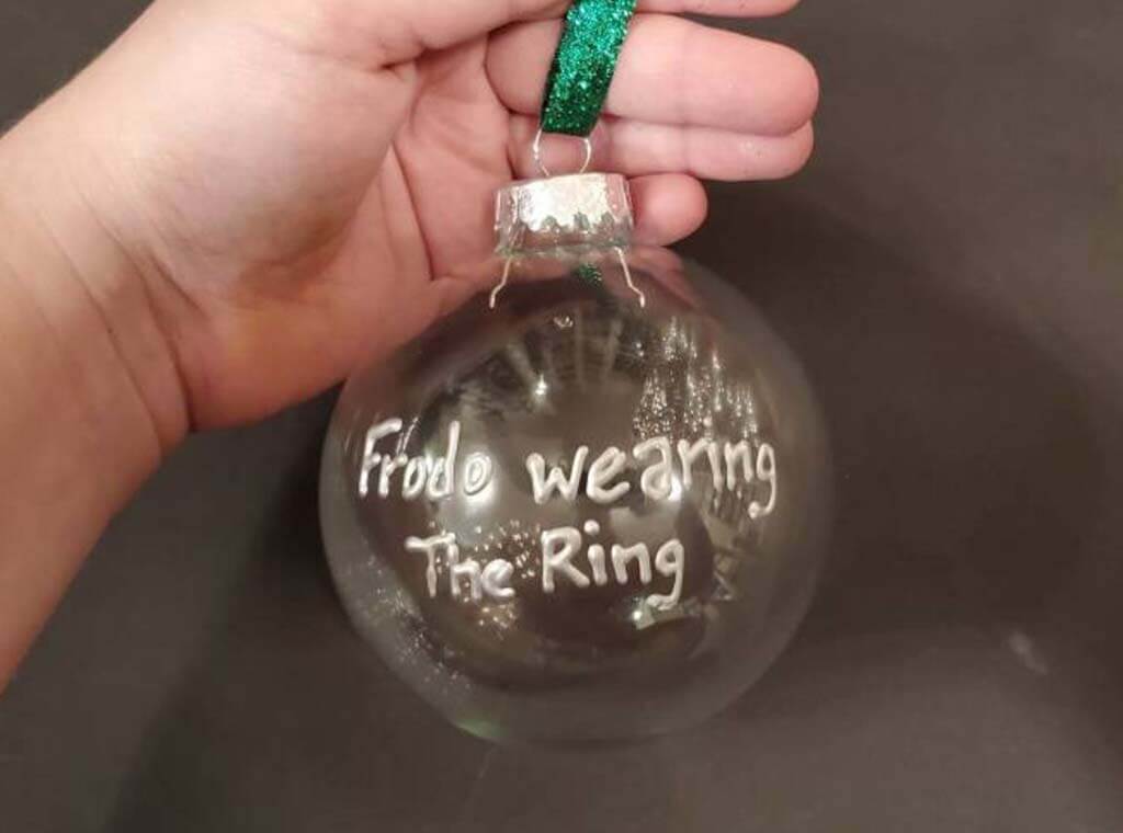 Glass ornament that is empty inside and reads "Frodo wearing the ring" by ShopPemberley