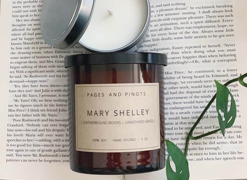 Brown glass candle jar with a label that reads "Mary Shelley" by PagesandPinots