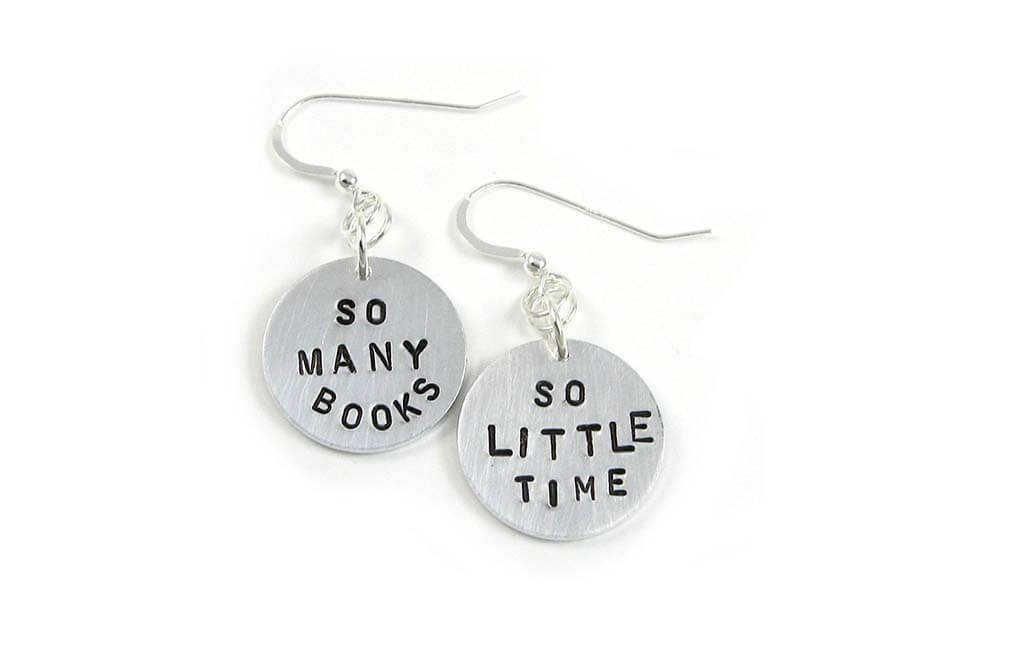 Round metal disk earrings with the words "So many books" and "So little time" stamped on them by MichelleMach