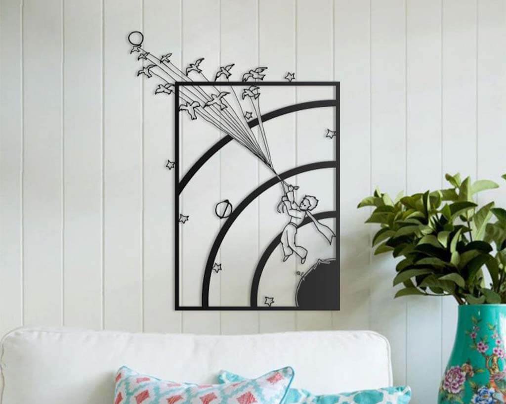 Metal wall art depicting the little prince flying away with birds by Metalwallartt