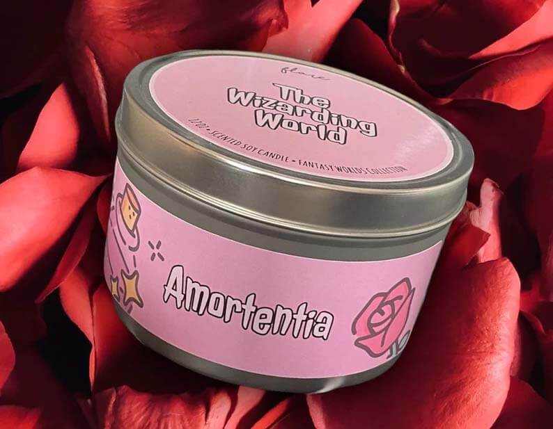 Pink candle tin that reads "Amortentia" by FlareCandleShop