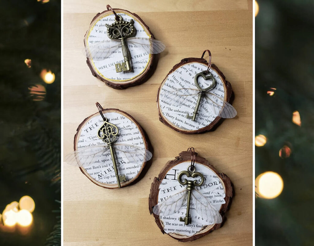 Wooden disk ornaments with book pages glued to the front and antique keys with wings from Harry Potter by ThatSassyArtChic