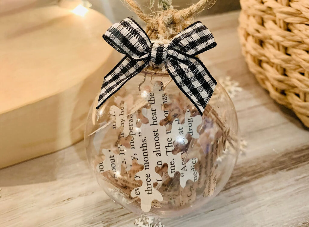 Ball Christmas ornament with snowflakes inside made of book pages by ATimelessReminder