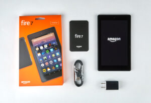 Kindle Fire 7 tablet flatlay with product box and charging cord